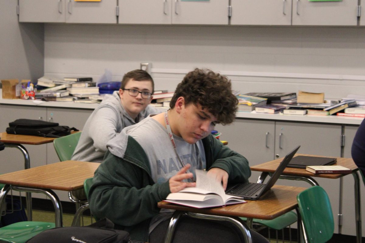 Freshman Noah McCulley reads Tuesdays with Morrie
for English. They are currently doing a reading workshop book.
