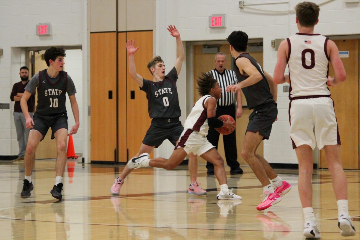 Shoot. Last year's senior player, Nymier Shields goes to shoot the ball to score for Altoona during last year's season. Shields played basketball all of his high school career. 