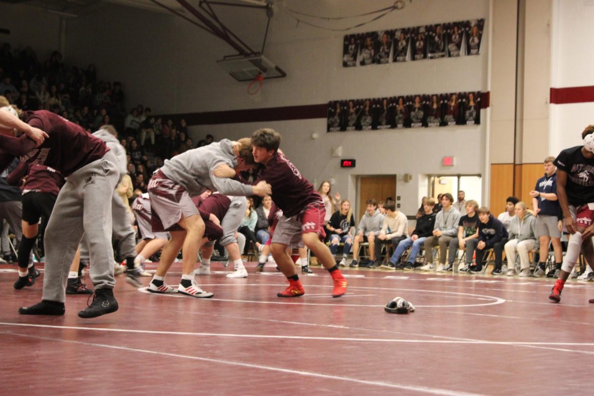 Ready for Battle. senior Evan Boose and senior Matthew Riccio warm up as partners on the first home match of the season. Both of these wrestlers pinned their opponent and Altoona won 64-4. 