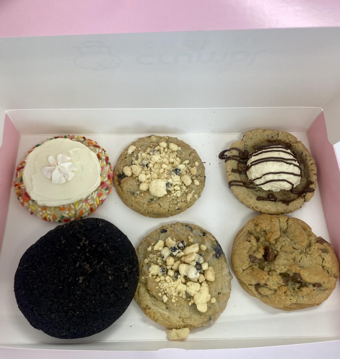 Crumble Cravings. Excited after viewing the flavors online, juniors, Addisen McDonald and Mya Meilnik make a trip to State College for Crumble Cookies the week of Jan. 1.