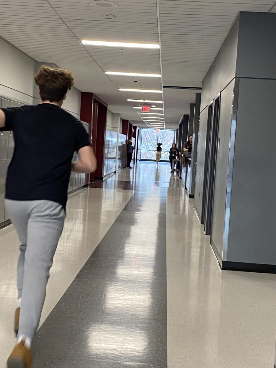 Students run across the top floor of the B building for an Anatomy lab. Running for one minute represents how homeostasis works on the human body, and the changes in heart and breathing rate for each student. 
