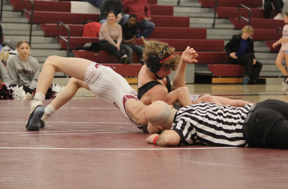 Sophomore Taber Baker wrestles against Indianas Nico Fanella. This was the wrestling teams first match of the new year. 