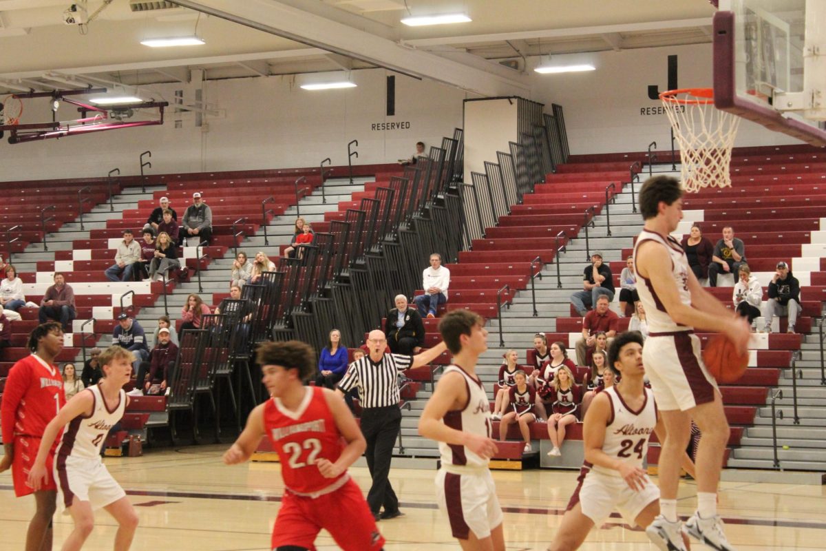 Get up. Senior Joshua Corso jumps to get the rebound as fast as he can, so they can score on offense. 

