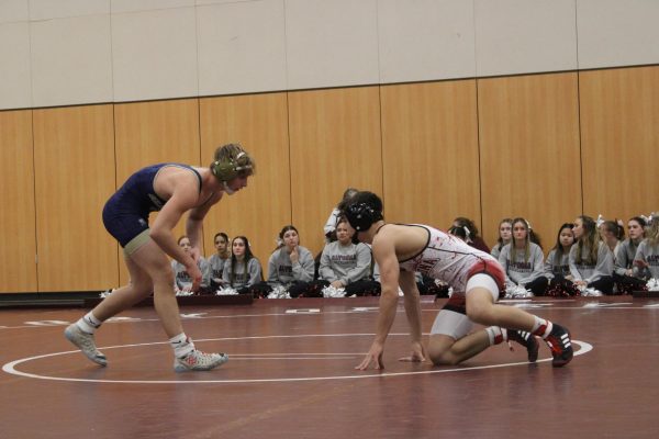Lowering the stakes. freshman Gavin Ciampoli lowers his level to get a takedown on his opponent om Jan. 31. Gavin won this match and improved his record to 17-6.