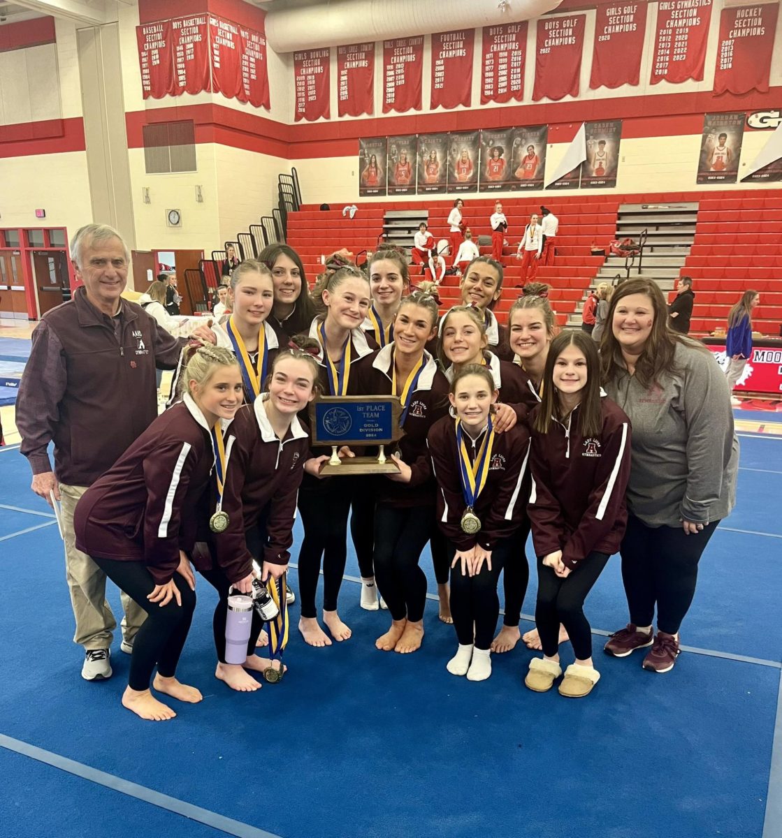 The best of the best. The gymnastics team poses for a photo together. The team took home first place at the State championship. (Courtesy of Isabella Bush)
