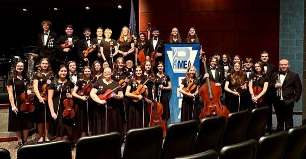 All smiles. District orchestra students pose before the concert on Saturday, Feb. 10 at Richland High School. Fourteen Altoona students moved on to Regions orchestra.