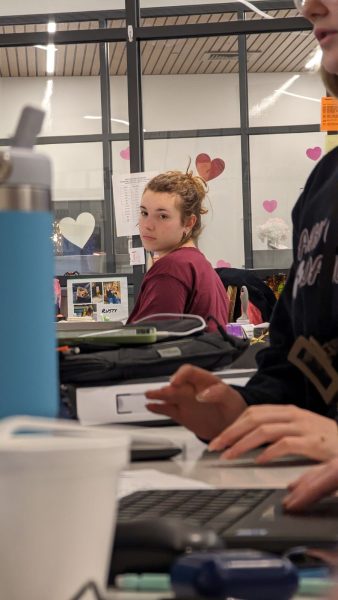 Focusing in: Senior Olivia McMinn focuses on editing the yearbook during her newswriting class.  