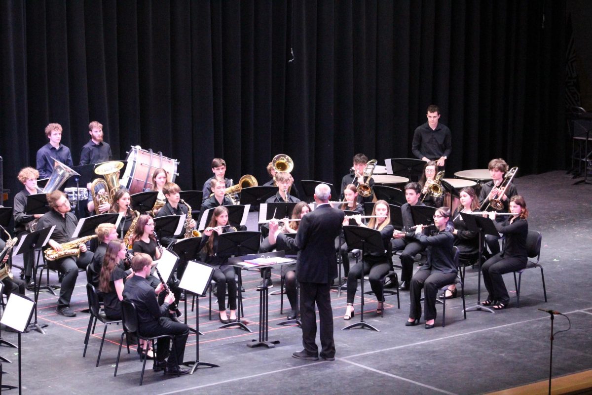 Inspiring+the+next+generation.+The+high+school+wind+ensemble+performs+under+the+direction+of+Larry+Detwiler.+They+were+the+final+performance+of+the+Band+Bash%2C+preceded+by+the+elementary+students+at+the+beginning+of+the+night+and+junior+high+school+students+in+the+middle.+
