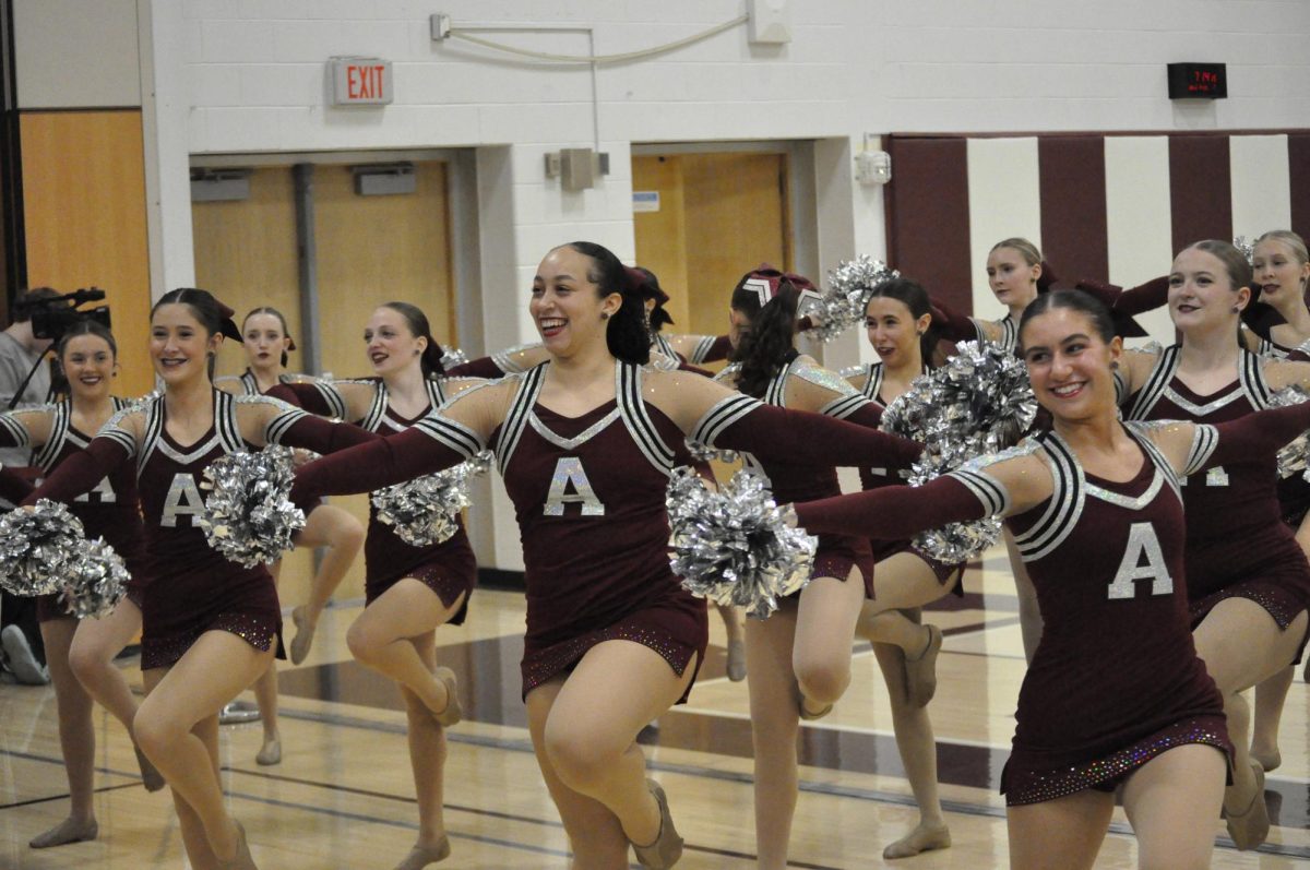 Dance the night away. Senior Mia Noel laughs as she dances her last fight song on senior night. The lioneers performed at the boys basketball game against Hollidaysburg. 