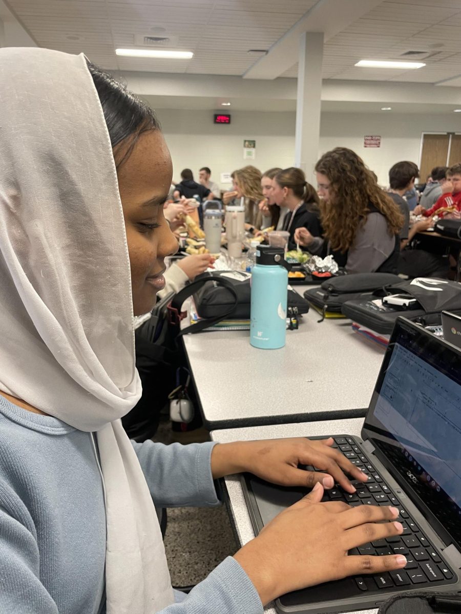 Senior Rayan Saeed works hard on her school work even during lunch, Its hard to stay motivated this year, but staying positive and confident get me through it, Saeed said.