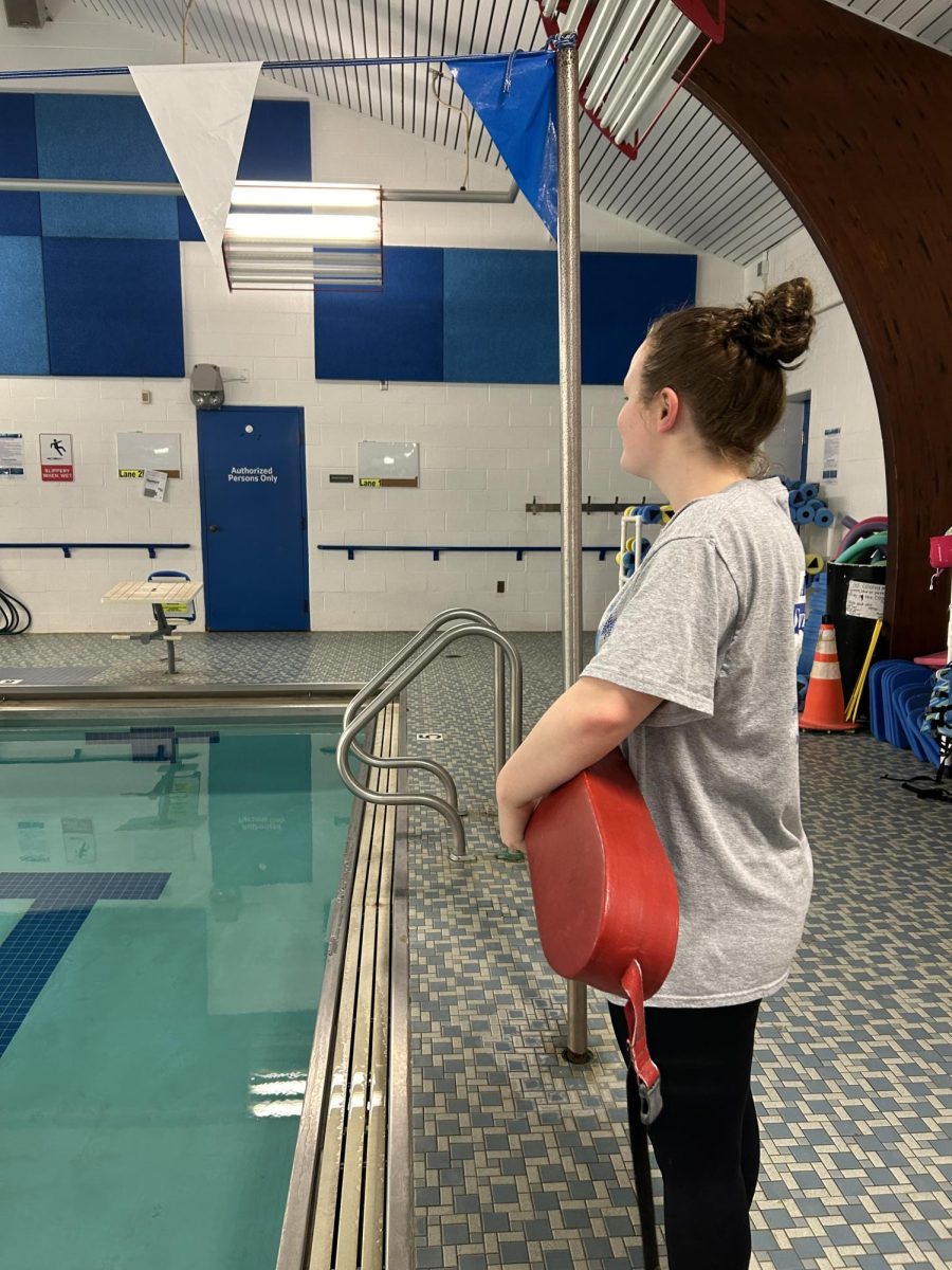 Keep an eye out. Senior Alexis Fraundorfer lifeguards at the pool at the YMCA. Fraundorfer works at a job at the pool and is on two swim teams. 