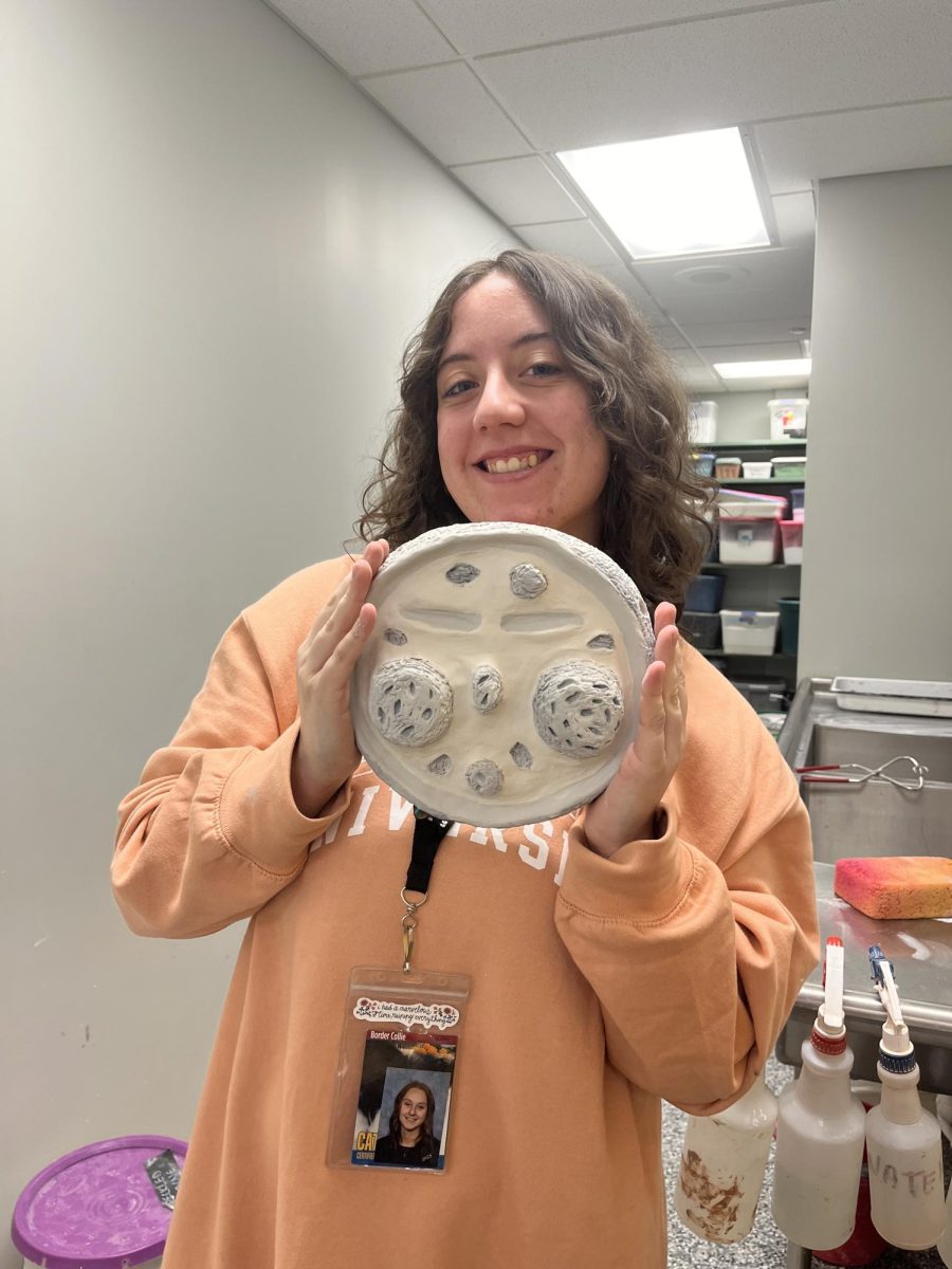 Moon man. Senior Mackenzie Musser created a mask for Ceramics 1 class. The assignment was to create a mask larger than someones face, and Musser decided to make a moon themed mask. 