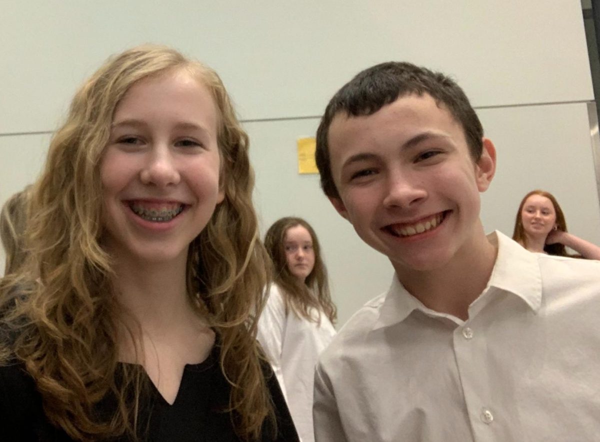 Smile! Junior Hannah Jack poses with her pen pal, Karter Shannon, prior to the String Spectacular Orchestra concert on Thursday, Feb. 29. Jack is a part of the high schools string ensemble and also volunteered to help elementary students playing in All City Orchestra. She plays the violin.