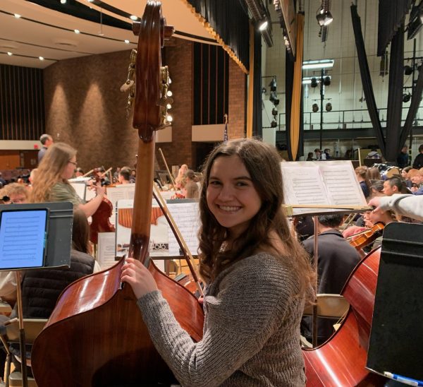 Success. Senior Sarah Saylor smiles prior to a western Region Orchestra rehearsal. Sailor earned second chair in the bass section after auditions, qualifying her for the State Orchestra festival. Western Region Orchestra lasted from March 21 - 23, with the festival concluding the festival on Saturday, March 23.