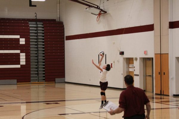 Serve. Boys volleyball plays in a match during the spring of 2023. The game on March 20 will take place in the fieldhouse. 