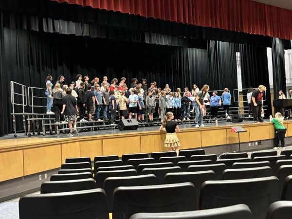 Hard at work. Chorus members rehearse for the annual chorus concert on May 2. 