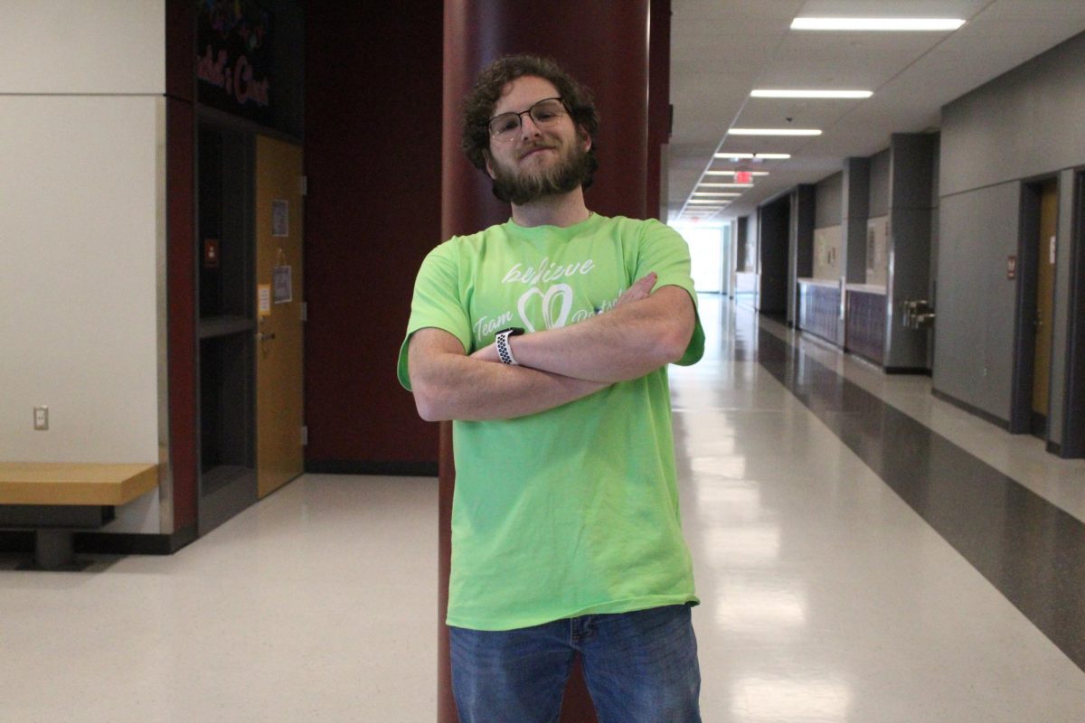 Keepin it cool. Math teacher Caleb Marasco poses for a photo with his T-shirt on. 