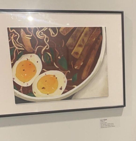 Trying something new. Junior Ava Cabells painting of a ramen bowl was chosen for display. I wanted to paint something unique with multiple layers, Cabell said. Her mother helped her complete the piece when she was struggling.