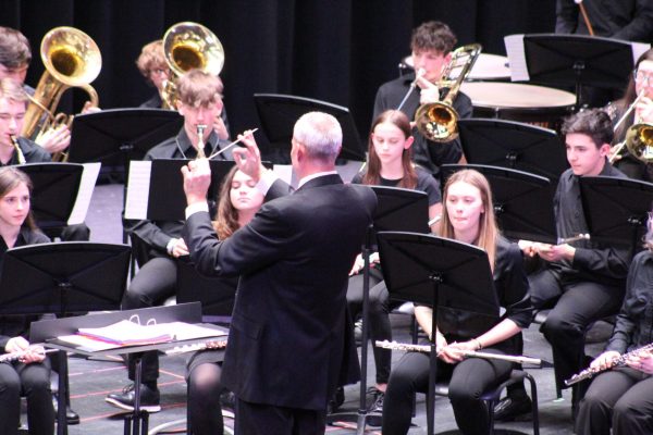Keeping the beat. Band director Larry Detwiler conducts the wind ensemble for the Band Bash concert. They played Symphony No. 1 The Lord of the Rings.
