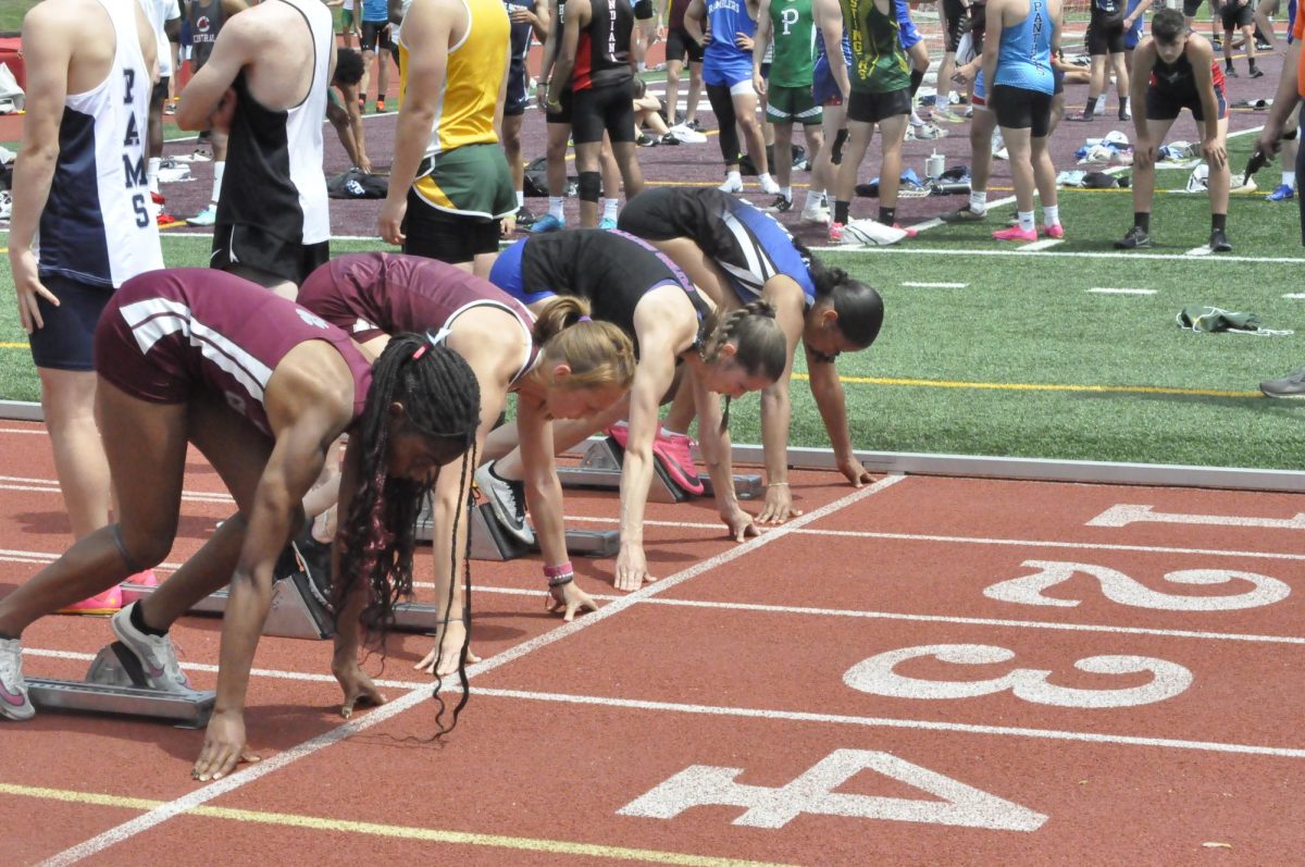 Get set. Freshman, Jill Long and sophomore, Brooklyn Weaver get ready to run the 100 m dash. Weaver placed in the top 10, sending her into finals. 