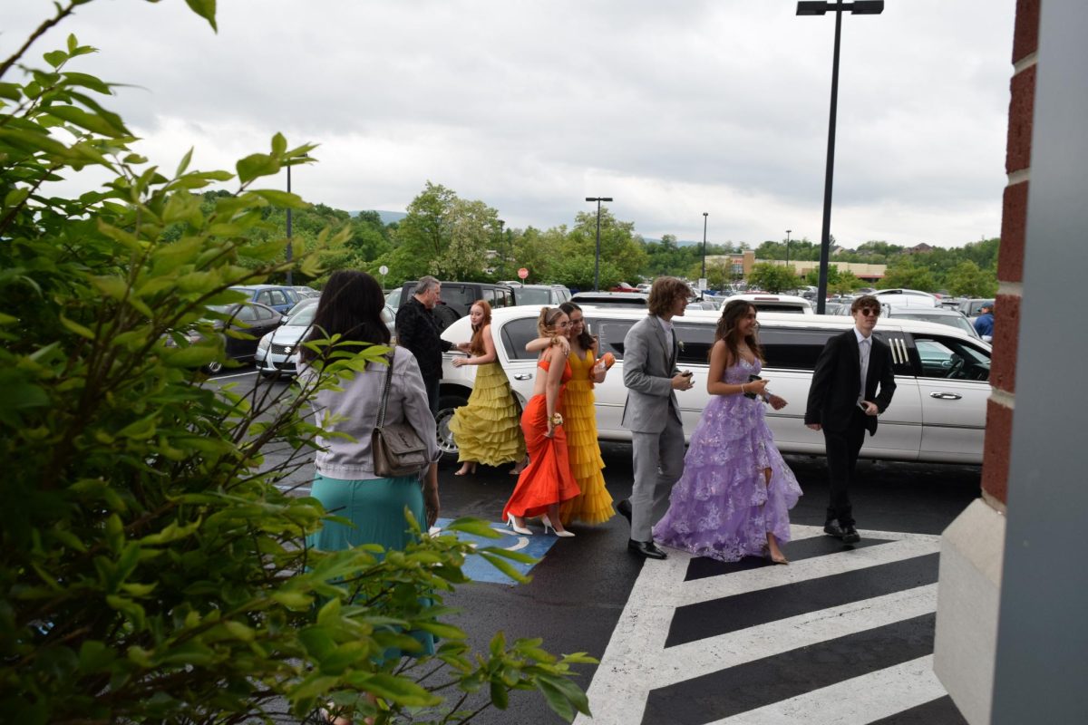 From dance studio to dance floor. A group of Blair Dance Academy girls all showed up to prom together. Pictured is Hollidaysburg student Ava Barton hugging her fellow teammate Lillian Roberts. Ella Beecham and Mia Curfman have also been friends with the group for years. 