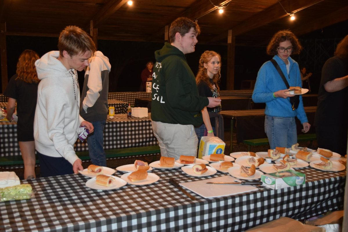 Time to eat. Students were given various food options to eat throughout the night during afterglo. There was pizza, sandwiches, cotton candy and cookies.