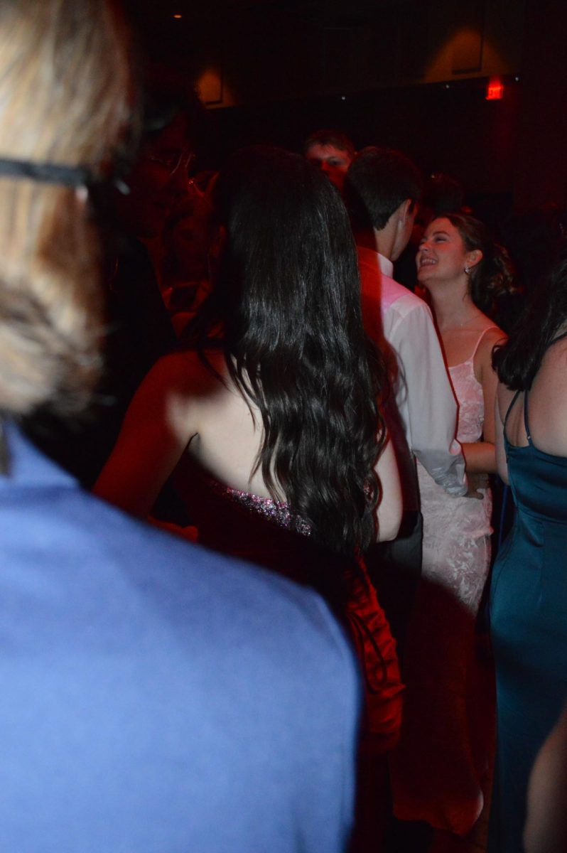 Only girl in the world. Senior Ryen Webster and alumni Kaitlyn Ventre share the spotlight on the dance floor. This is their second prom together as a couple. 