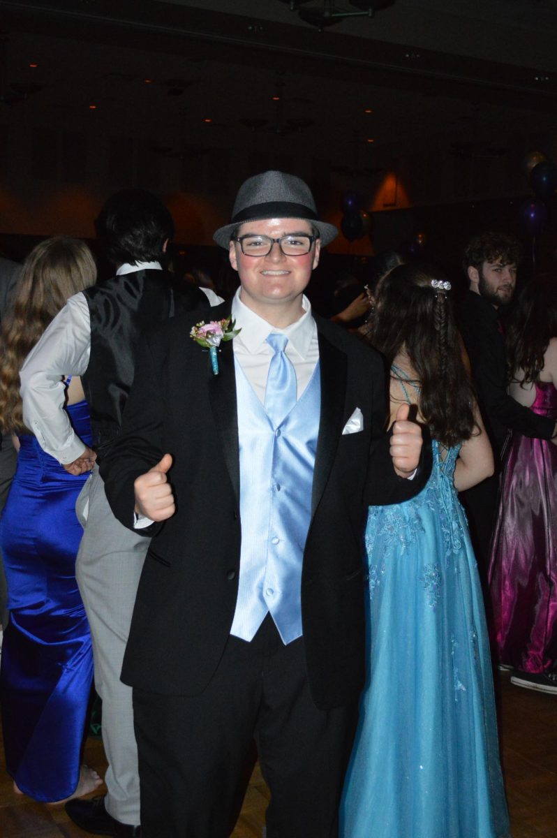 Strike a pose! Sophomore Adam Savino poses for a photo while at prom. 