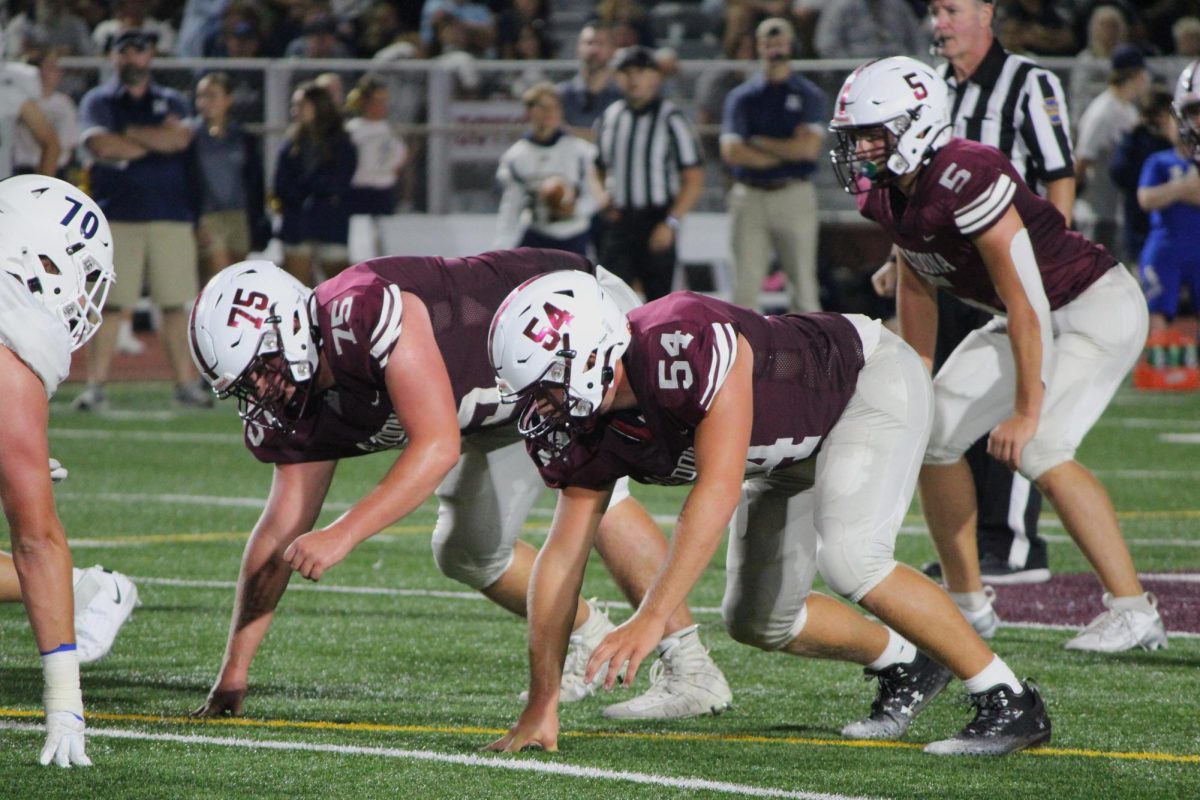 
Senior Calvin Troutman and junior Wes Baumgartner prepare for a play at the Hollidaysburg game on Aug. 23. Hollidaysburg took home the win, 27-14.