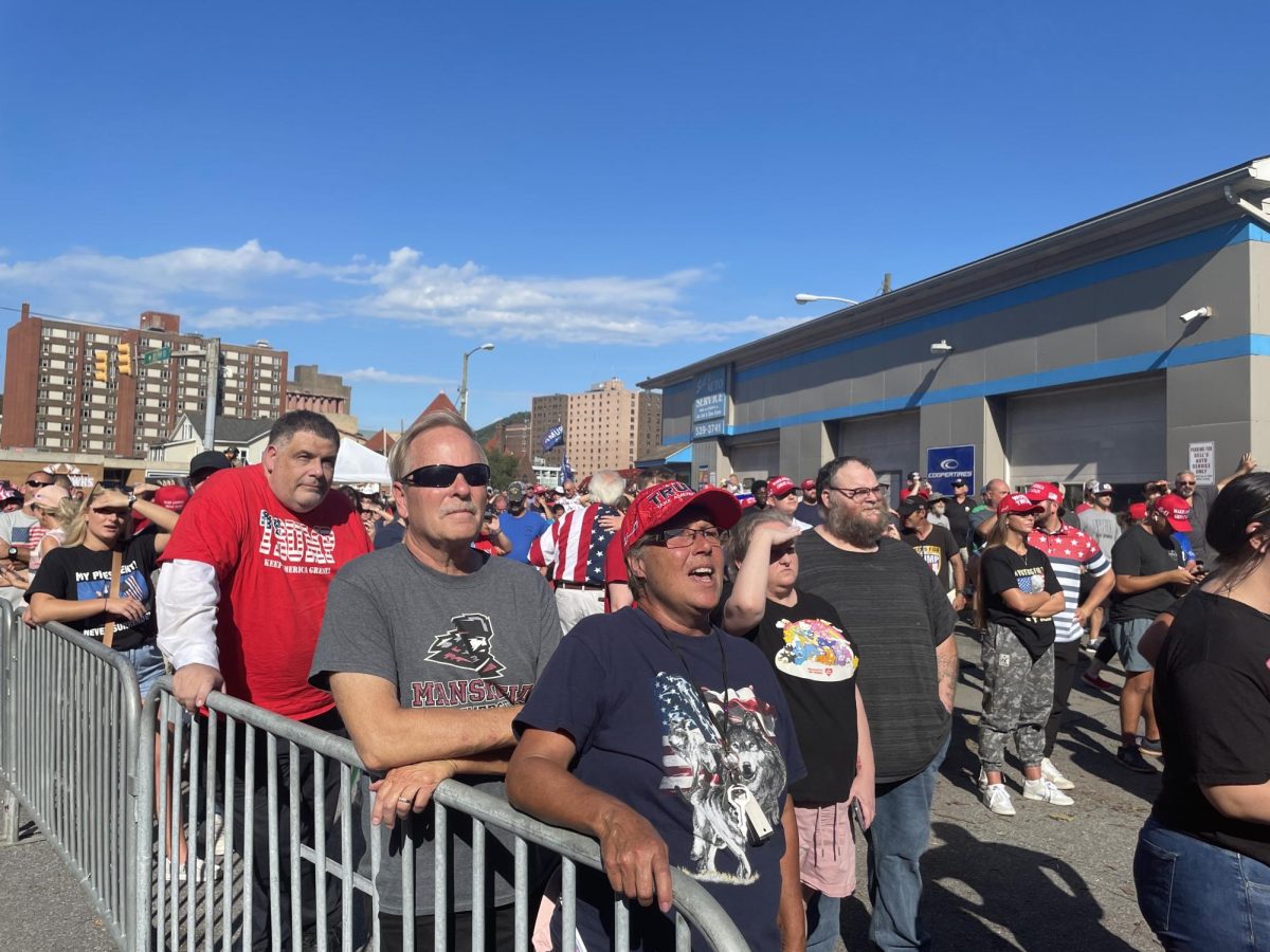 "USA, USA, USA" Trump supporters cheer as Trump takes the stage inside the arena. 