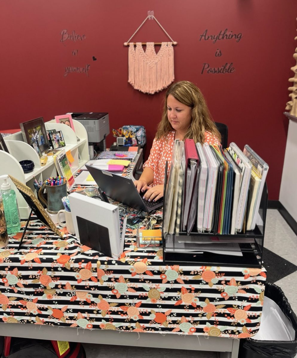 Julie Storm plans a workshop for next week's class. She helped Autumn Barry-Kyle with her reading workshop classes. 