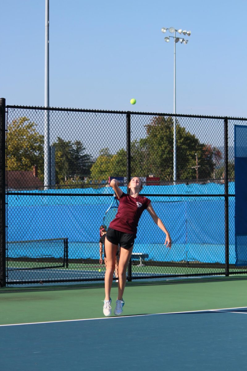 S. Irwin takes her turn at serving the ball. She was hopeful about the match. 