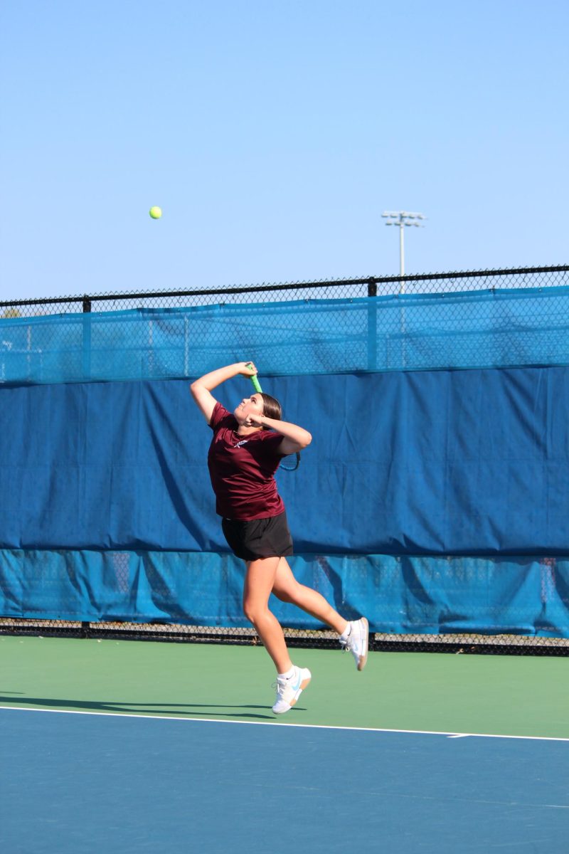 Freshman Emma Hovan jumps to serve the ball. Players had to arrive at Mansion Park by 8 a.m. 