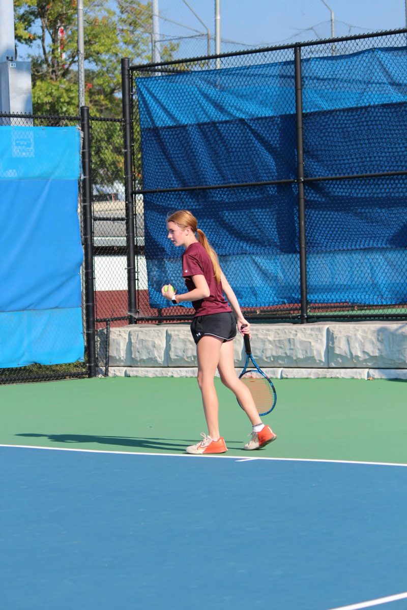 C. Irwin focuses on playing her match. C. Irwin is one of the varsity senior players. 