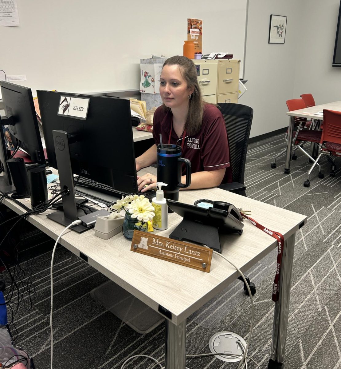 Hard at work. Part of Lantz's job entails making phone calls and keeping up to date with families dealing with attendance issues. Lantz deals with all truancy at the school. 