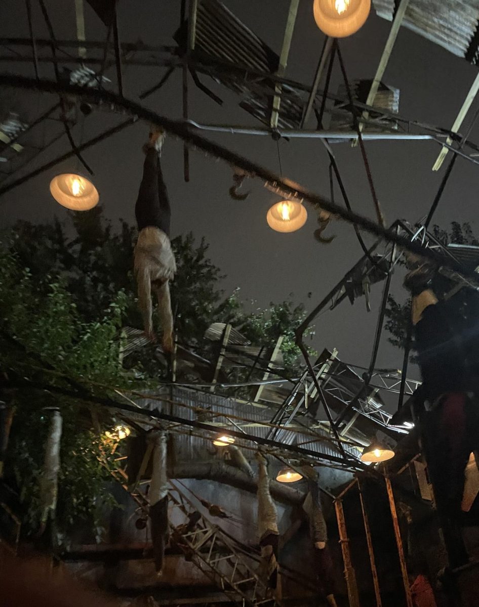 Don't look up. Passengers of the haunted hayride watch fake bodies fly overhead, as they are told that they may be next by an actor. This scene is from the abandoned warehouse set of the "Field of Screams" hayride. 