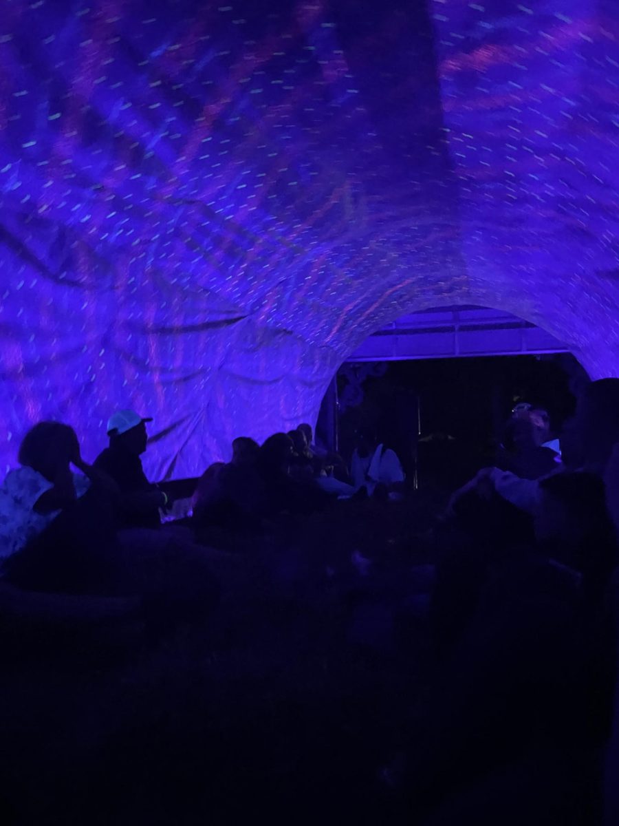 Vertigo. Riders of the "Field of Screams" haunted hayride sit in a long tunnel that looks to be moving around them. The hayride took tourists through several horror sets, including a big top circus and an alien research center.