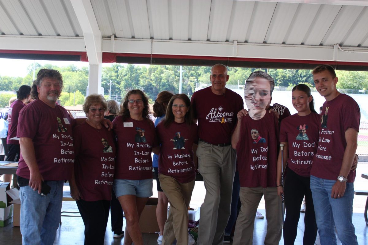 The band's back together. The Detwiler family poses for a photo to show off their  T-shirts. 