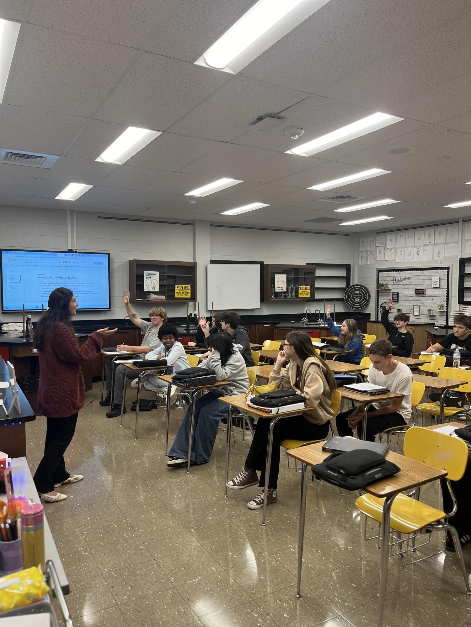 Raise those hands! First year chemistry teacher Gianna Marasco teaches her class full of students eager to answer questions.