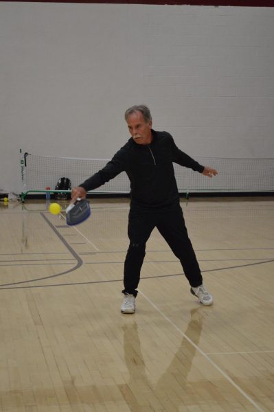 Chorus teacher Kelly Sipes was instrumental in starting the pickleball club last school year.  This year the program continued and volunteers like John Anthony support the student players each week. (Courtesy of Madalyn Miller)