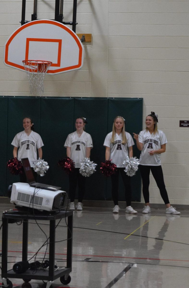 Excitement. Cheerleaders wait patiently to perform for the students. Several cheerleaders traveled to Pleasant Valley on Oct. 10 for this event. 