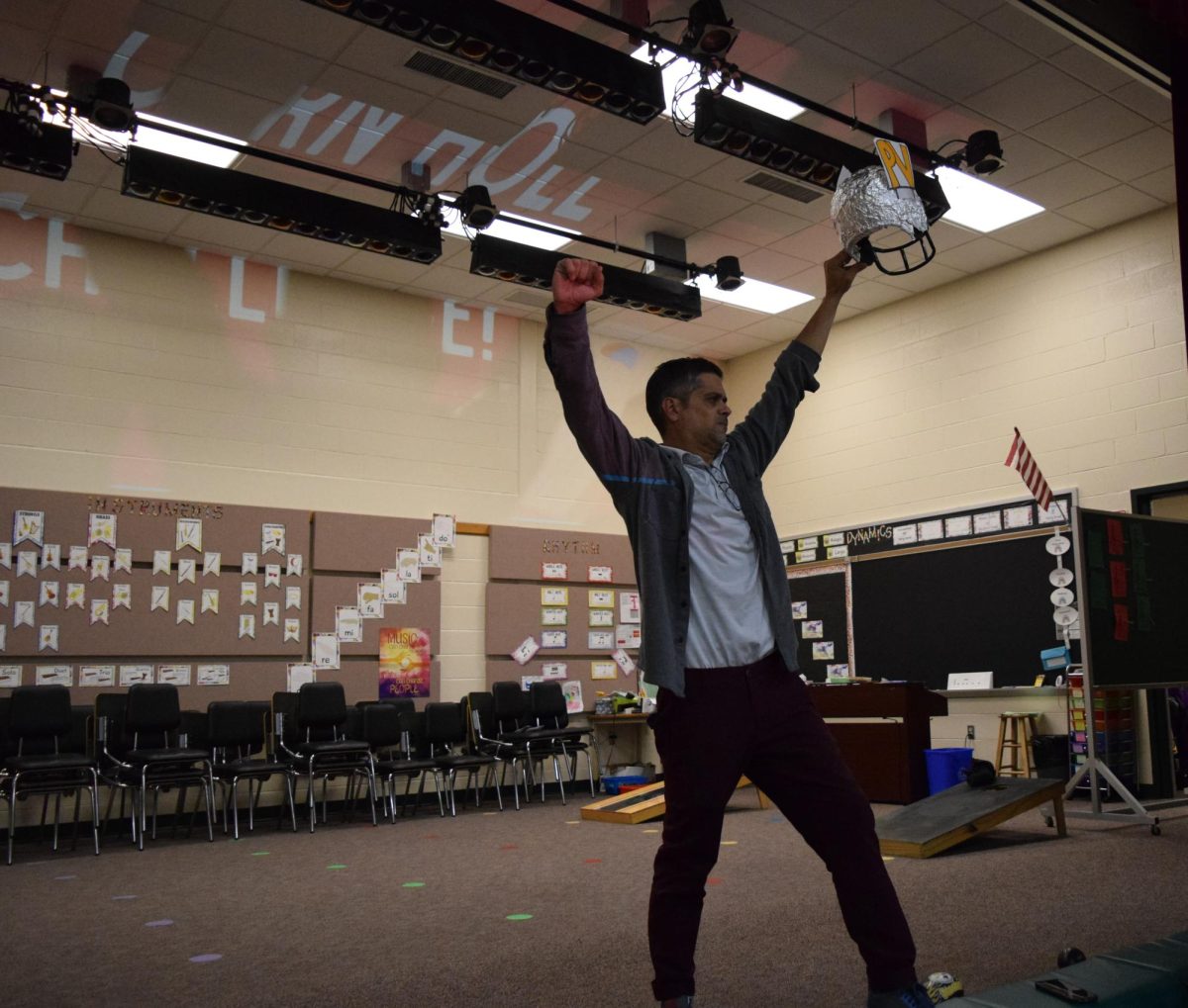 Showing off. Fifth grade teacher Daniel Disabato holds up the trophy to show it off. Disabato got the students excited about their new WIG initiative. 