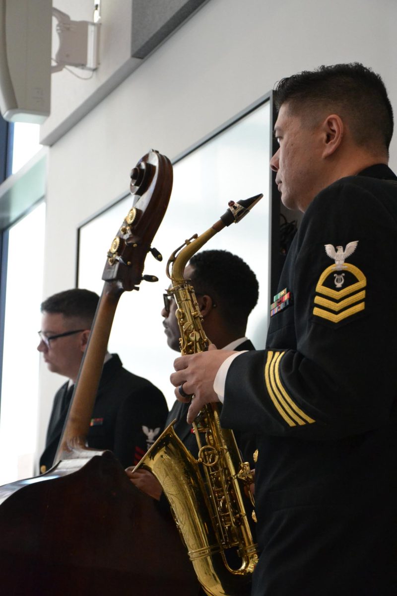 Listen closely. Commodores watch on as the Advanced Jazz Ensemble perform for them during a clinic. 