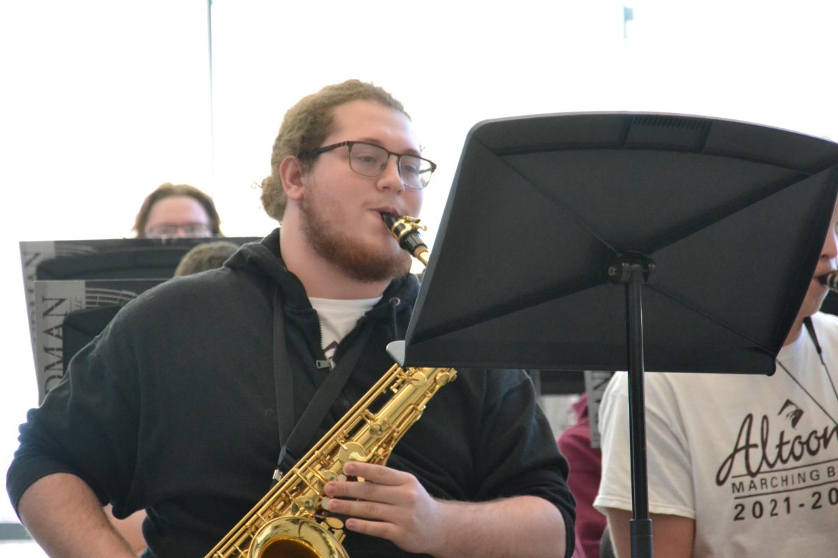 Shining talent. Senior Aleksander Swalga performs a solo during practice. 