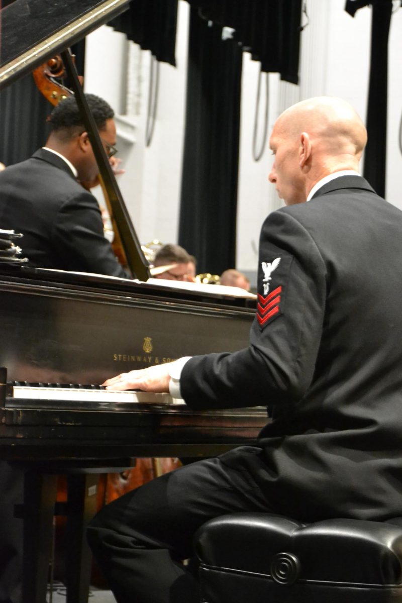 Jazz hands. Navy Commodores are completely focused in during their performance. 