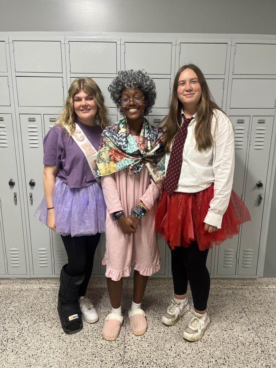 Candidate Stayley Drenning and senior Mary Worley dress up as Fear and Anger from the original “Inside Out” movie. Senior Zyon Vanlue dressed up as nostalgia from the new movie “Inside Out 2”. 