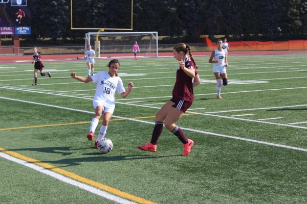 Kicking off to playoffs. Junior Isabella Miller plays in a soccer game against Bishop McDevitt high school. The team is now going on to playoffs. (Courtesy of Tristan Sunderland)