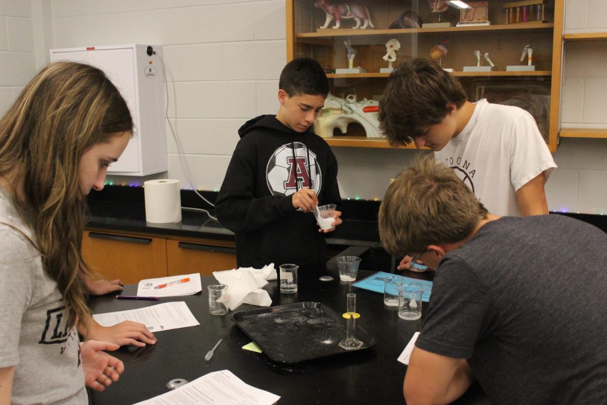 Freshmen, Ava Miller, Elijah Gibson, Hunter Kling, and Lucas Morrissey conduct tests to gather their needed data.