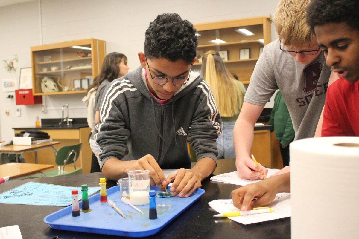 Freshmen Diego Gil, and Ryder Krause pay close attention to the results of their science experiment.