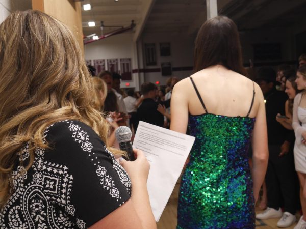 Candidates make their grand entrance at last year’s dance. Every year, each candidate and their escort are announced at the dance.  